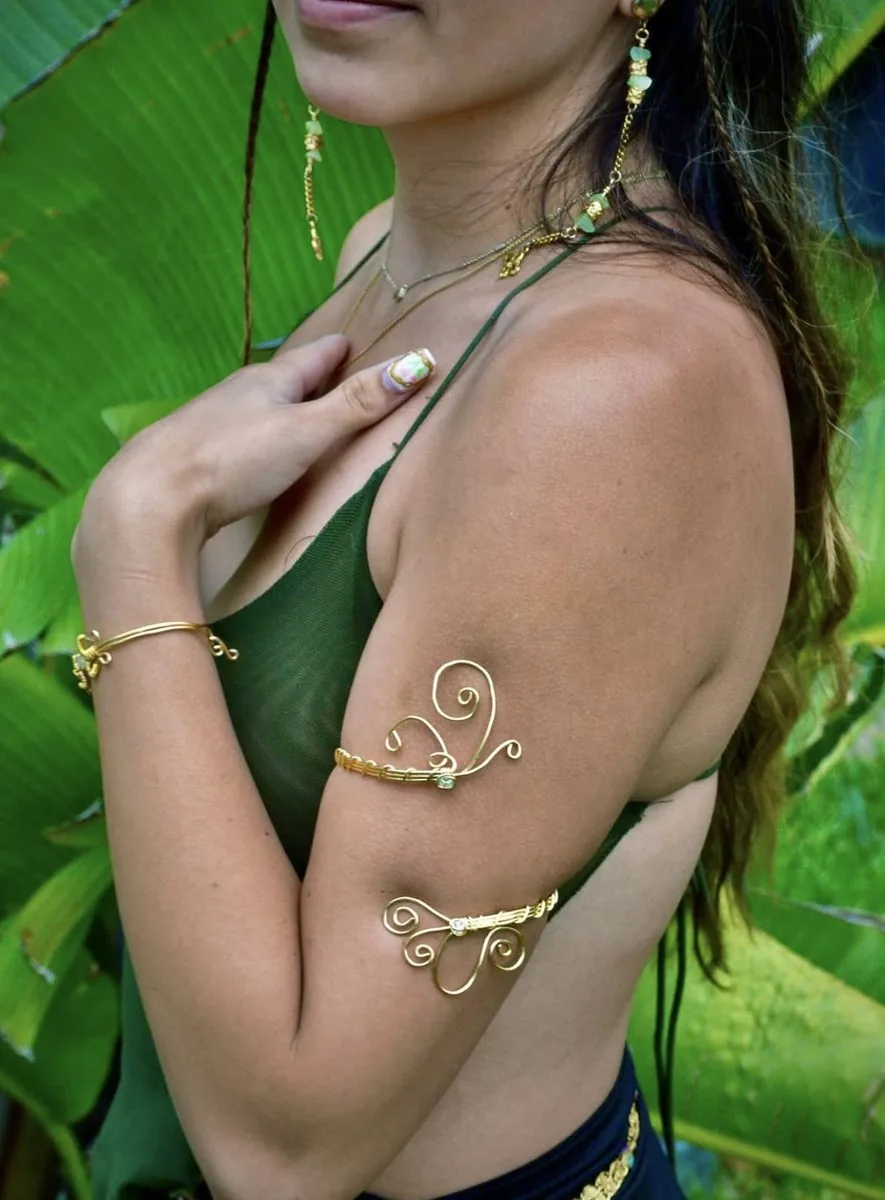 Gold arm cuff worn outdoors